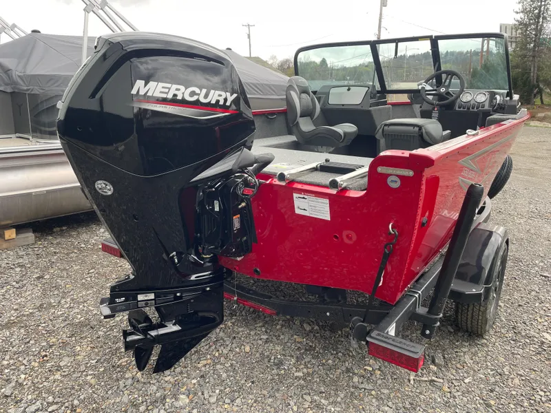 Slide: The Image of 2025 Lund 1650 Rebel XL Sport boat with Mercury outboard engine, red exterior. - 7