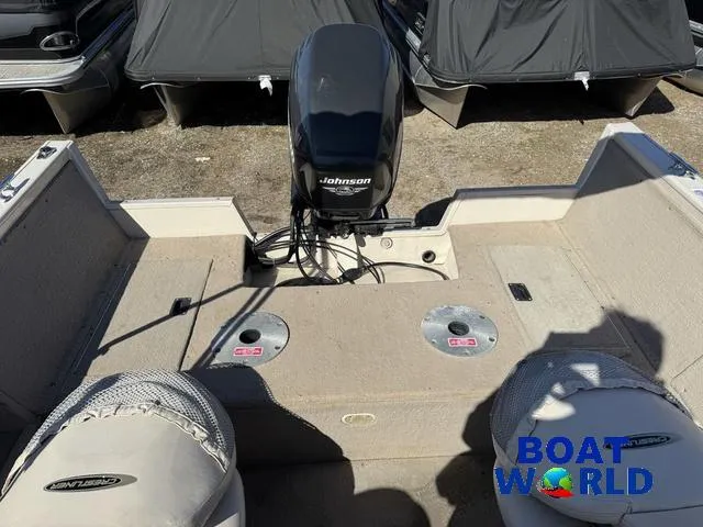 Slide: The Image of 2002 Crestliner Super Hawk 1700 boat interior with Johnson motor, dual seats, and storage compartments. - 10