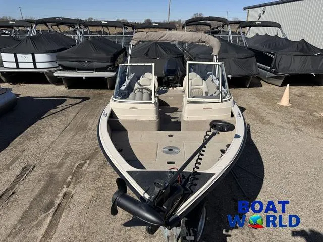 Slide: The Image of 2002 Crestliner Super Hawk 1700 boat at Boat World dealership, parked outdoors. - 12