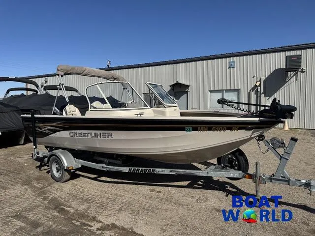 Slide: The Image of 2002 Crestliner Super Hawk 1700 boat on trailer outside Boat World building. - 22