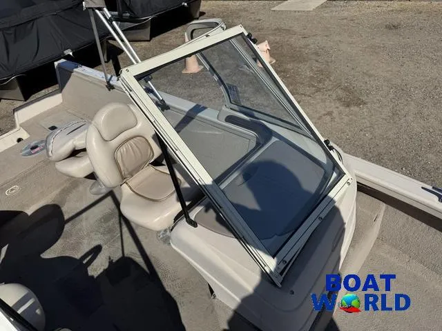 Slide: The Image of 2002 Crestliner Super Hawk 1700 boat interior with windshield and seating, Boat World logo visible. - 23