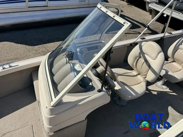 Slide: The Image of 2002 Crestliner Super Hawk 1700 boat interior with seating and windshield, labeled "Boat World." - 24