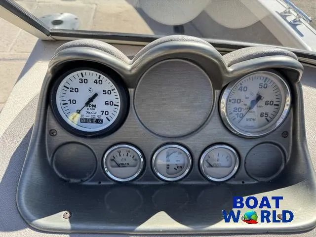Slide: The Image of Dashboard of 2002 Crestliner Super Hawk 1700 boat with gauges and Boat World logo. - 28