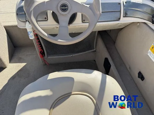 Slide: The Image of 2002 Crestliner Super Hawk 1700 boat interior with steering wheel and seating. - 31