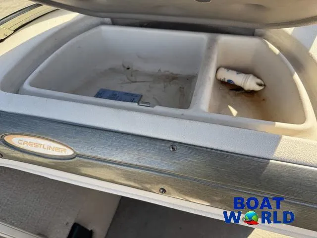 Slide: The Image of Open storage compartment in 2002 Crestliner Super Hawk 1700 boat, featuring dual sections. - 36
