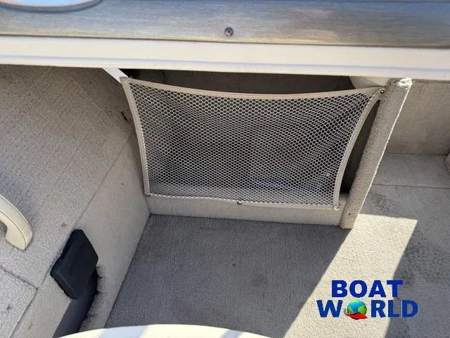 Slide: The Image of 2002 Crestliner Super Hawk 1700 interior storage compartment with mesh netting. - 37