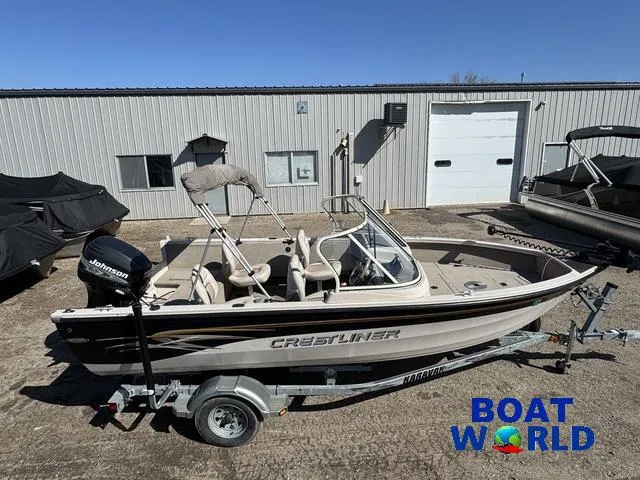 Slide: The Image of 2002 Crestliner Super Hawk 1700 boat on trailer, parked outside a warehouse. - 4