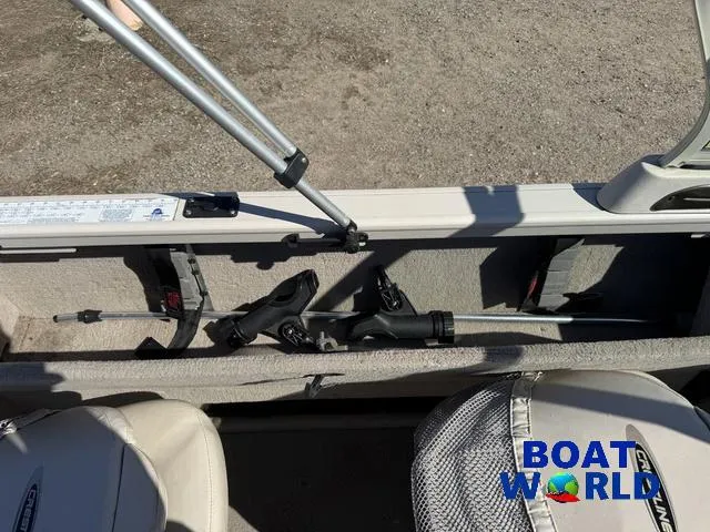 Slide: The Image of 2002 Crestliner Super Hawk 1700 interior with fishing rod storage and seating. - 41