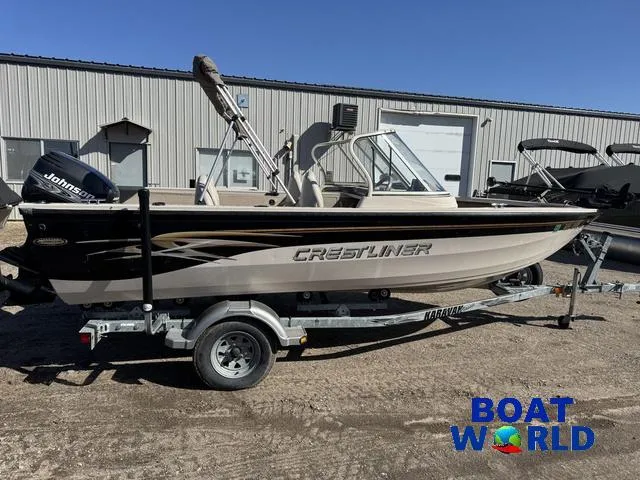 Slide: The Image of 2002 Crestliner Super Hawk 1700 boat on trailer, parked outside Boat World building. - 42
