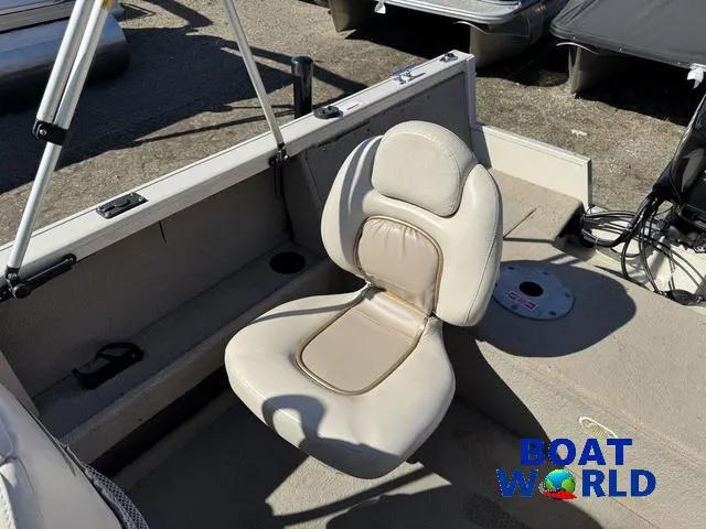 Slide: The Image of 2002 Crestliner Super Hawk 1700 boat seat, beige upholstery, outdoor setting. - 43