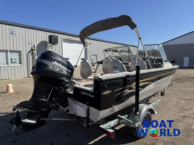 Slide: The Image of 2002 Crestliner Super Hawk 1700 boat with Johnson outboard motor, parked outside Boat World. - 45