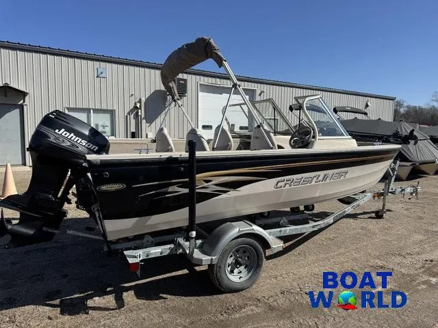 Slide: The Image of 2002 Crestliner Super Hawk 1700 boat with Johnson outboard motor on trailer. - 8