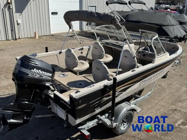 Slide: The Image of 2002 Crestliner Super Hawk 1700 boat with Johnson outboard motor on trailer. - 9