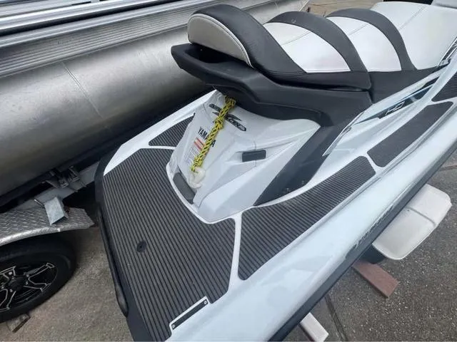 Slide: The Image of 2018 Yamaha Waverunner FX Cruiser HO, sleek design, black and white seating, docked. - 3