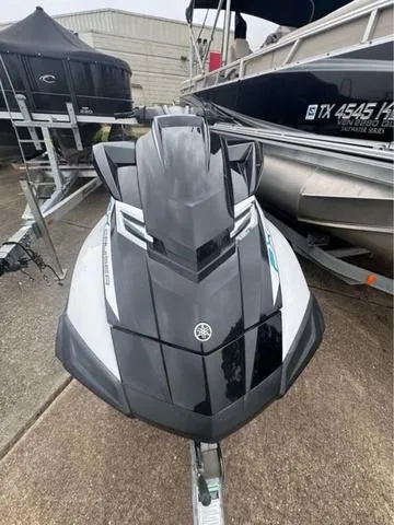 Slide: The Image of 2018 Yamaha Waverunner FX Cruiser HO, sleek black design, parked on trailer. - 6