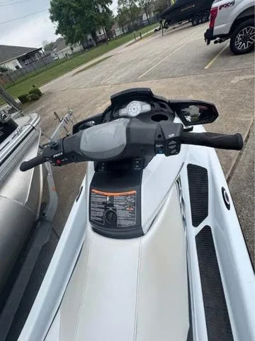 Slide: The Image of 2018 Yamaha Waverunner FX Cruiser HO, parked in a lot, showcasing handlebars and dashboard. - 7