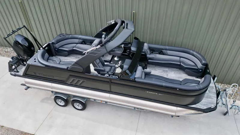 Slide: The Image of 2025 Viaggio Diamante UWA pontoon boat with sleek black design and spacious seating. - 19
