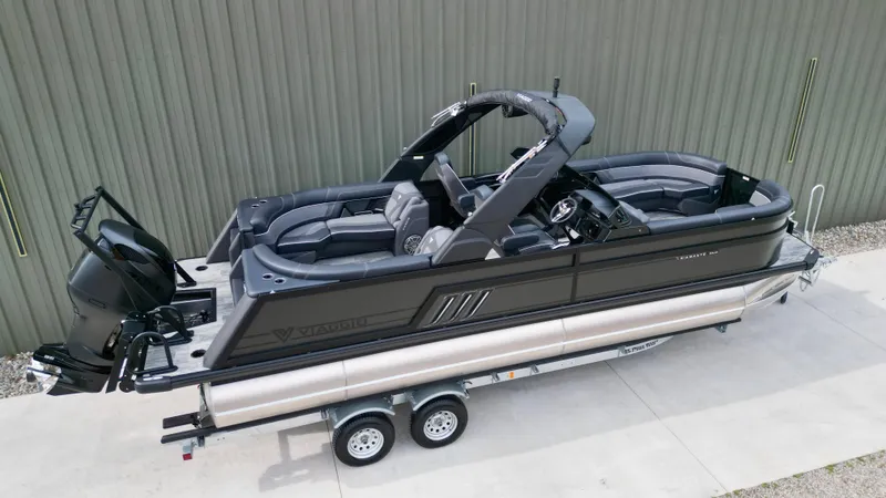 Slide: The Image of 2025 Viaggio Diamante UWA pontoon boat on trailer, sleek design, dual-axle, modern features. - 2