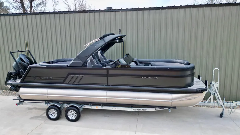 Slide: The Image of 2025 Viaggio Diamante UWA pontoon boat on trailer, parked outdoors. - 20