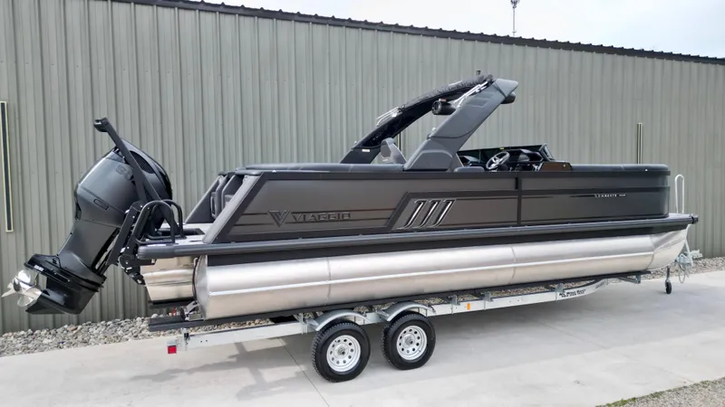 Slide: The Image of 2025 Viaggio Diamante UWA pontoon boat on trailer, sleek design, powerful outboard motor. - 21
