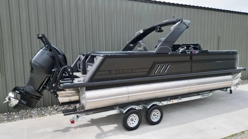 Slide: The Image of 2025 Viaggio Diamante UWA pontoon boat on trailer, featuring sleek black design and powerful outboard motor. - 22