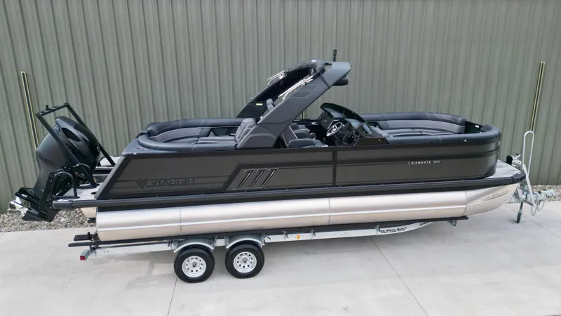 Slide: The Image of 2025 Viaggio Diamante UWA pontoon boat on trailer, sleek design, parked outdoors. - 24