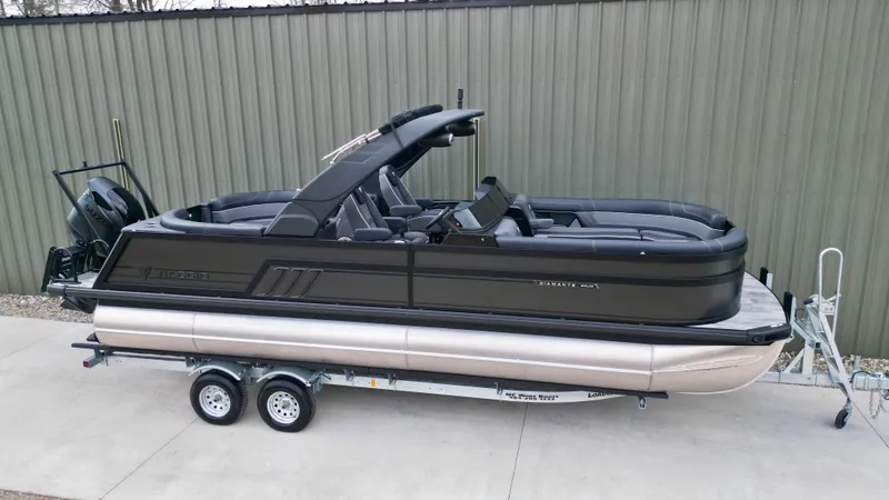 Slide: The Image of 2025 Viaggio Diamante UWA pontoon boat on trailer, sleek design, parked outdoors. - 27