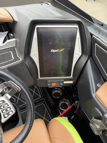 Slide: The Image of 2022 Tigé 24 RZK boat dashboard with touchscreen display and controls. - 17