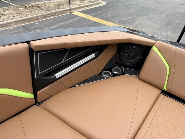 Slide: The Image of 2022 Tigé 24 RZK boat interior with tan upholstery and speaker system. - 22