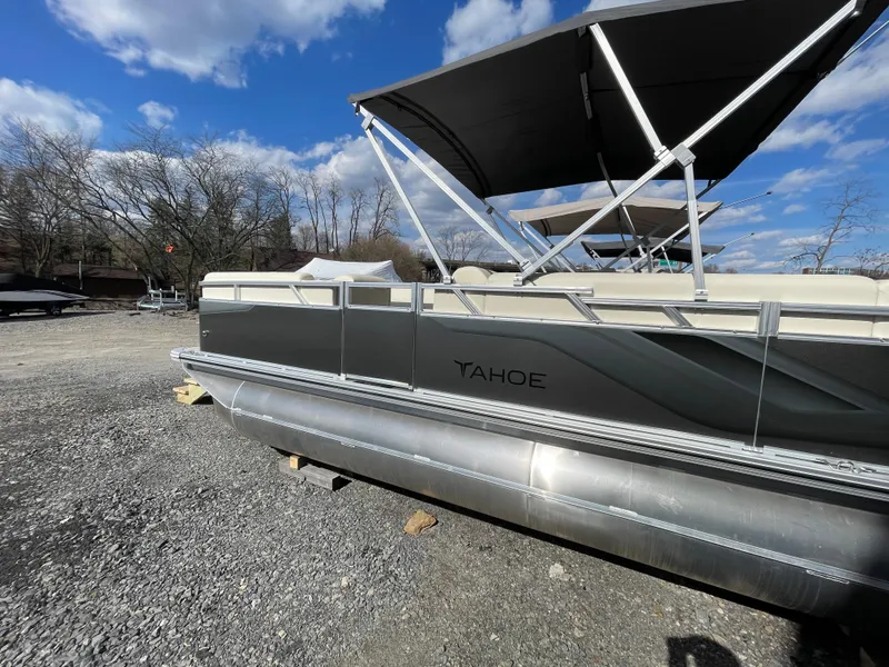 Slide: The Image of 2025 Tahoe Pontoon 1980 STX CRUISE interior seating, beige upholstery, modern design. - 4