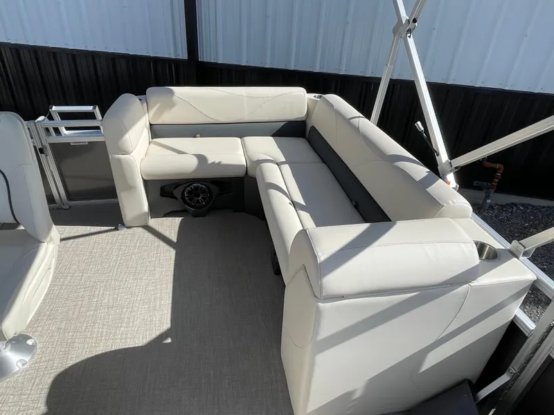 Slide: The Image of 2025 Tahoe Pontoon 1980 STX CRUISE with beige seating and modern design. - 6