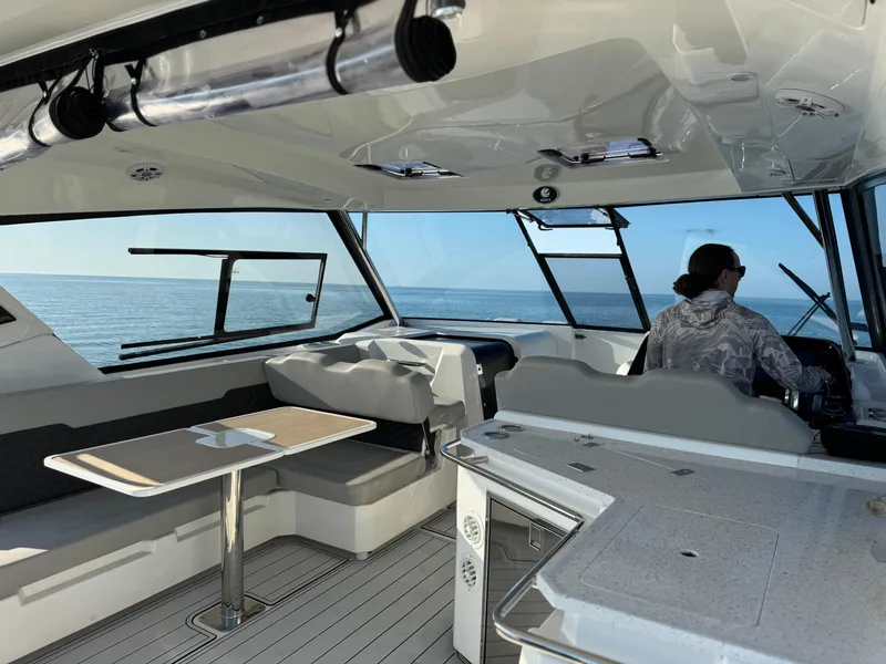 Slide: The Image of Interior of 2019 Aquila 36 Sport yacht with seating, table, and ocean view. - 30