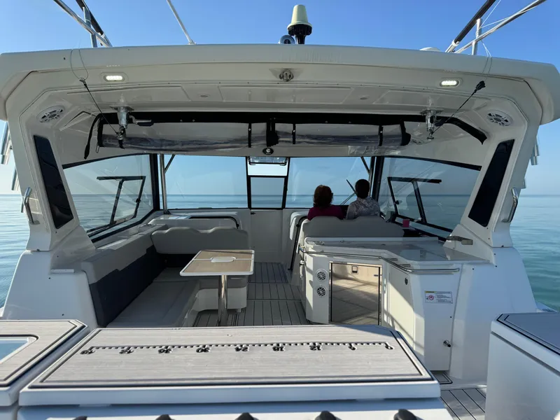 Slide: The Image of 2019 Aquila 36 Sport yacht interior with two people enjoying the ocean view. - 33