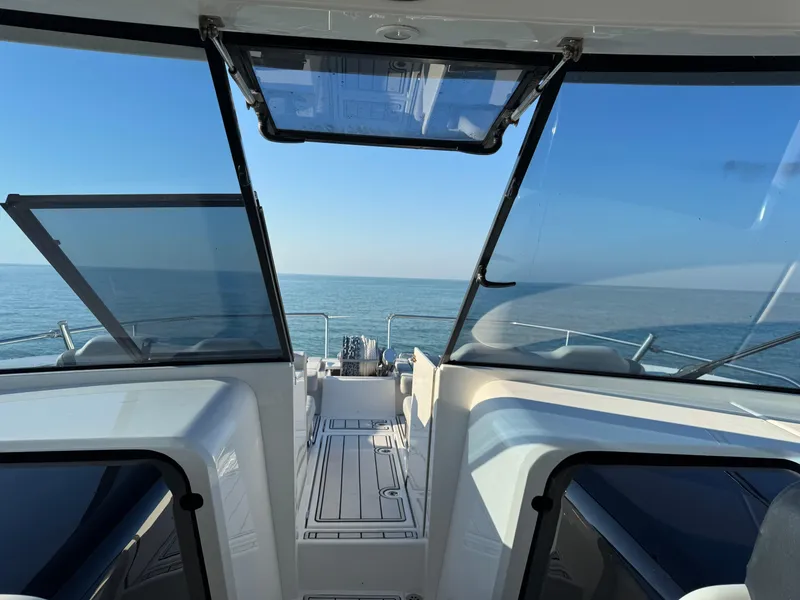 Slide: The Image of Aquila 36 Sport 2019 boat interior with ocean view through open windows. - 40