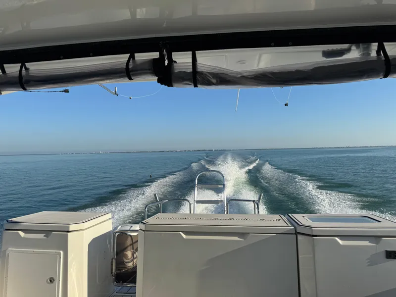 Slide: The Image of Aquila 36 Sport 2019 cruising on open water, leaving a wake behind. - 44