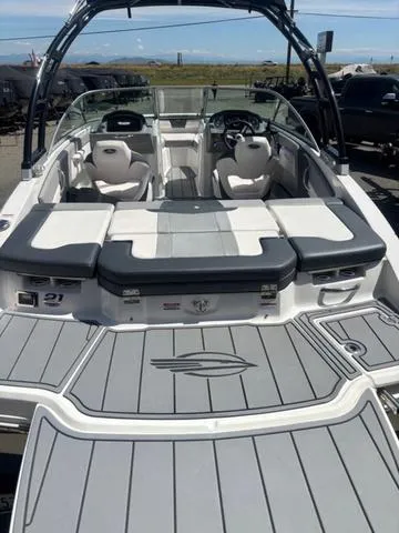 Slide: The Image of 2021 Chaparral 21 SSi boat with sleek interior and spacious seating. - 12