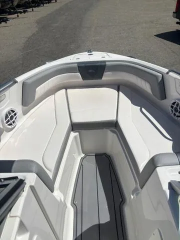 Slide: The Image of 2021 Chaparral 21 SSi boat interior with white seating and gray accents. - 9