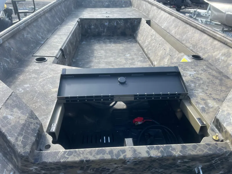 Slide: The Image of 2025 Excel 1751 River Warrior boat interior with open storage compartment. - 10