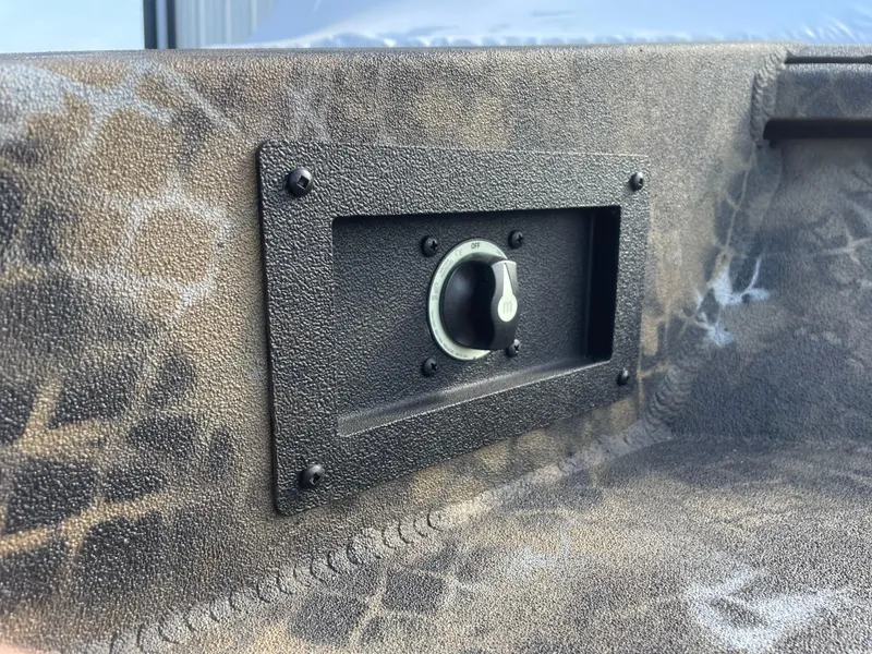 Slide: The Image of Control panel on 2025 Excel 1751 River Warrior boat with camouflage design. - 11