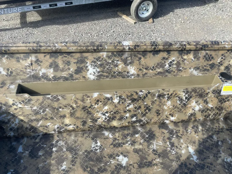 Slide: The Image of 2025 Excel 1751 River Warrior boat with camouflage pattern, gravel background. - 15