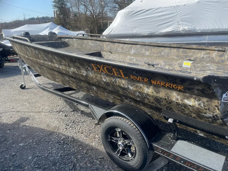 Slide: The Image of 2025 Excel 1751 River Warrior boat on trailer, camo design, parked outdoors. - 5