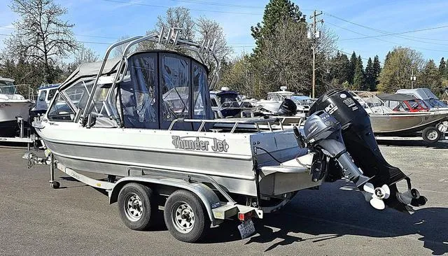 Slide: The Image of 2008 Thunder Jet 20 Luxor boat on trailer, parked outdoors. - 15