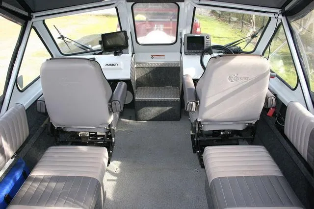 Slide: The Image of Interior of 2008 Thunder Jet 20 Luxor boat with seating and navigation equipment. - 5