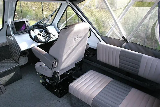Slide: The Image of Interior of 2008 Thunder Jet 20 Luxor boat with seating and control panel. - 6