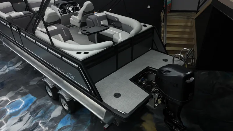 Slide: The Image of Luxurious 2025 Viaggio Lago X-U pontoon boat with modern seating and powerful outboard motor. - 24