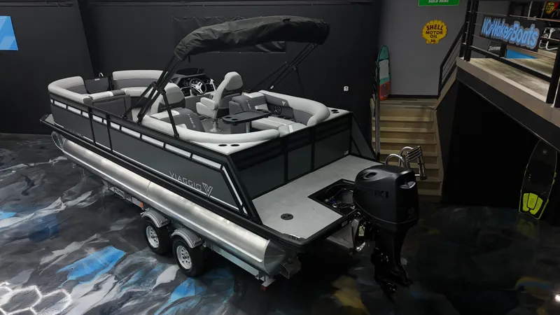 Slide: The Image of Viaggio Lago X-U 2025 pontoon boat with sleek design and modern features in showroom. - 25