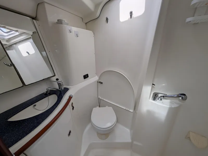 Slide: The Image of Bathroom interior of 2003 Beneteau Oceanis 473 yacht, featuring sink and toilet. - 11