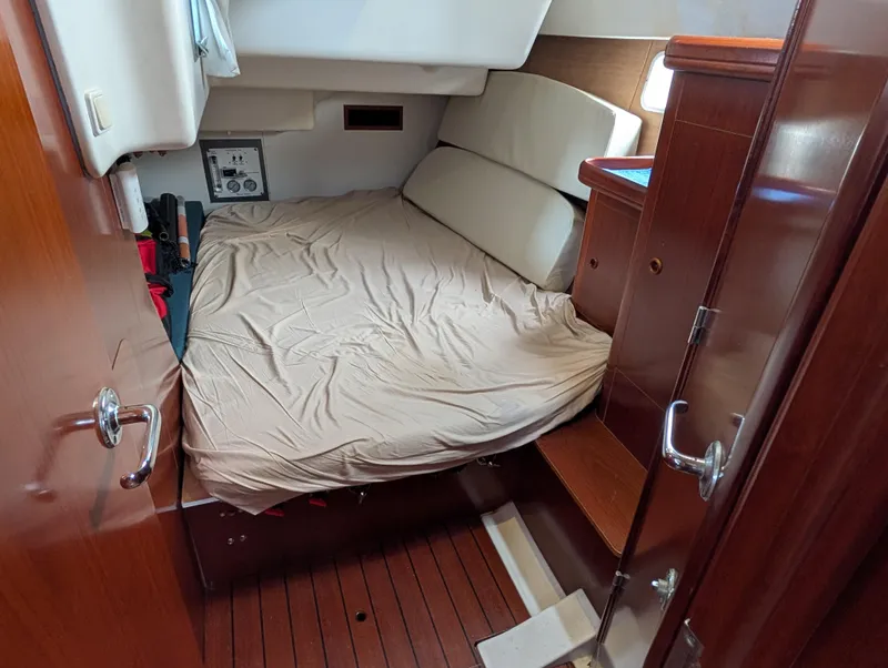 Slide: The Image of Cozy cabin interior of 2003 Beneteau Oceanis 473 sailboat with wooden finish. - 26