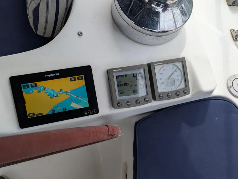 Slide: The Image of Navigation instruments on a 2003 Beneteau Oceanis 473 sailboat cockpit. - 33