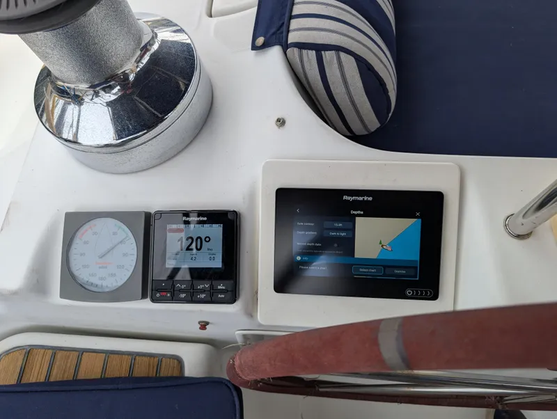 Slide: The Image of Beneteau Oceanis 473 cockpit with navigation instruments and striped cushion, 2003 model. - 34